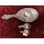 Two silver caddy spoons and a silver backed hairbrush.