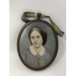 A 19th Century oval framed miniature on ivory depicting a lady in profile.