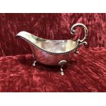 A silver sauce boat.