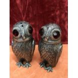 A pair of Continental silver novelty cruets in the form of owls.