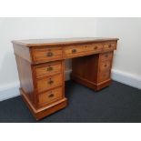 An Edwardian style twin pedestal desk.