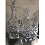 A Webb Crystal vase together with a decanter and Edinburgh Continental decanter ewer.