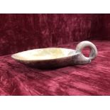 A very unusual soap stone ladle.