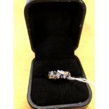 A platinum set sapphire and diamond ring.