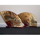 Two large contemporary Chinese fans.