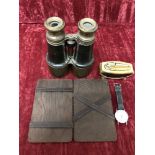 A pair of leather clad and brass racing binoculars, a Ronson lighter, and a wallert.