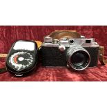 A vintage Canon F1.9 Serenar Camera and a Weston Master II.