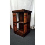 A contemporary mahogany revolving bookcase.