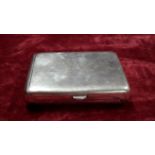 A large silver double cigarette case with "Virtute et Opera" engraved to the front.