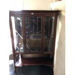 An Edwardian mahogany glazed china display cabinet with undertier.