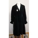 A vintage long dark green velvet coat, fully lined.