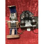 Two cameras and a pair of binoculars.