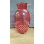 A 19th Century cranberry jug.