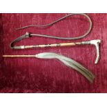 A plaited leather riding crop and short cane and horse hair riding whip.