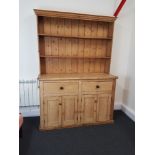 A large late 19th Century pine country kitchen dresser.