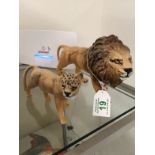 A Beswick lion and lioness.