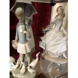 Three assorted Lladro figurines.