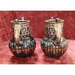 A pair of reproduction Egyptian revival vases.