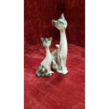 A pair of porcelain cats.