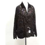 A vintage embroidered black velvet, long unlined jacket.