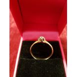 An 18ct gold (unmarked) solitaire diamond ring.