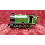 A tin wind-up Hornby train set with working locomotive and key.