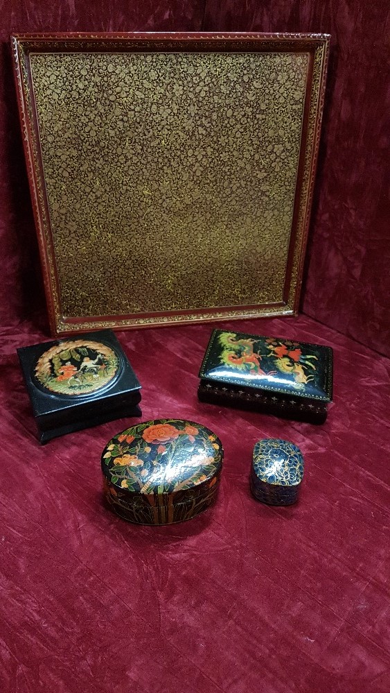 A fine lacquered wooden tray plus four lacquered boxes.