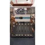 A Players Cigarettes polished steel wall mounted vending machine with six trays.