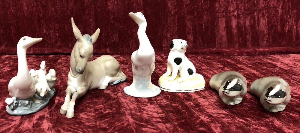 An assortment of ceramic figures of animals.