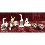 An assortment of ceramic figures of animals.
