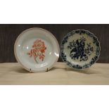 An 18th Century Worcester blue and white plate and a Wedgwood creamware transfer botanical plate.