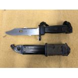 An AK47 bayonet with combination wirecutter in its scabbard. Blade length 14cms