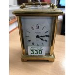 A brass carriage clock stamped Duverdrey and Bloquel France to the base.