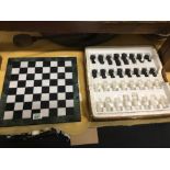 A boxed marble chess set in good order.
