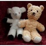 A vintage teddy bear and a vintage Farnell Alpha lamb.