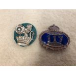 A pre 1953 GPO gilt and enamel cap badge plus an early British Rail cap badge.