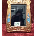 A lovely copper and enamel photograph frame.
