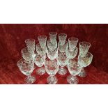 Three sets of crystal and glass wine glasses.