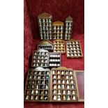 A collection of closed and open cases containing thimbles.