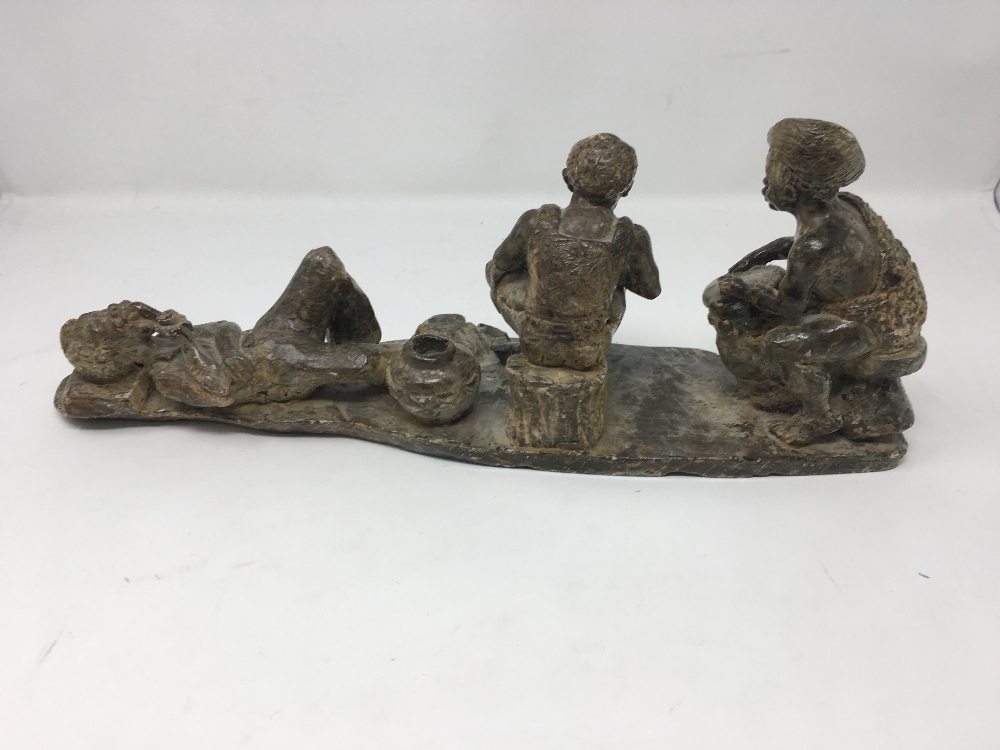 A fine African carved stone rustic sculpture of three assorted African figures in pose. - Image 3 of 5