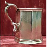 A white metal tankard.