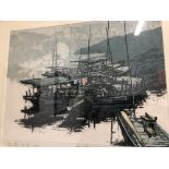 A framed limited edition block print depicting moored junks.