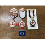 A set of three vintage British Red Cross Society medals.