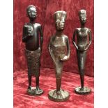 A group of three African carved wooden tribal figures