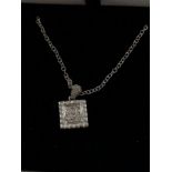 An 18ct white gold pave set diamond pendant necklace on a silver chain.