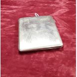 A silver cigarette case Hallmarked Birmingham 1945