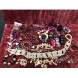 A box of assorted costume jewellery.