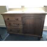 A 19th Century waxed pine dresser base cabinet.