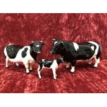 A Beswick Friesian bull, cow and calf.