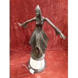 An Art Deco bronze of a Persian dancing lady mounted on a Tennessee marble base. Signed.